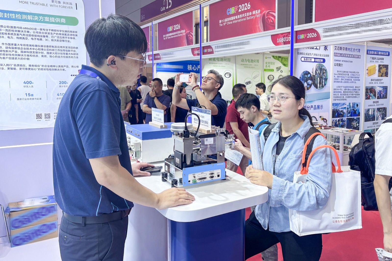 WAYEAL team demonstrating helium leak detection equipment to CIBF 2026 visitors